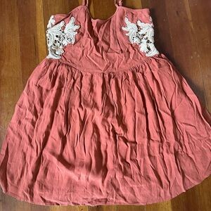 Rayon top with peep side accents.